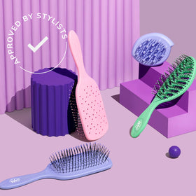 Wet Brush Go Green Curl Detangler on a bathroom counter