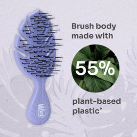 Wet Brush Go Green Mini Detangler on a bathroom counter