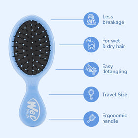Wet Brush Mini Detangler held in hand for size comparison