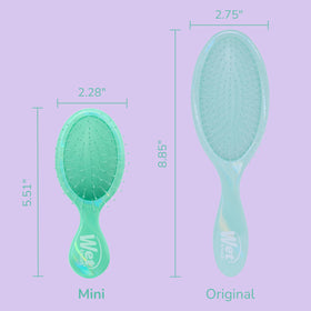 Wet Brush Mini Detangler in hand for travel use