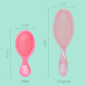 Wet Brush Mini Detangler in hand for travel use