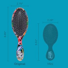 Wet Brush Original Detangler displayed with tropical background