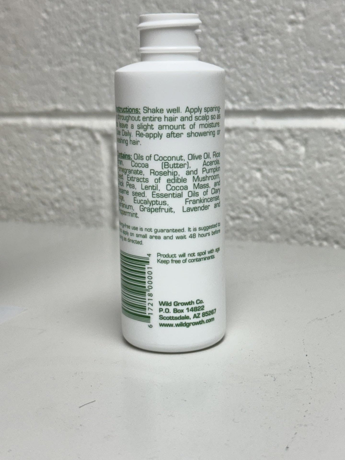 Wild Growth Hair Oil 4oz back view showing ingredients