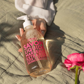Wild Rose Liquid Soap with floral background