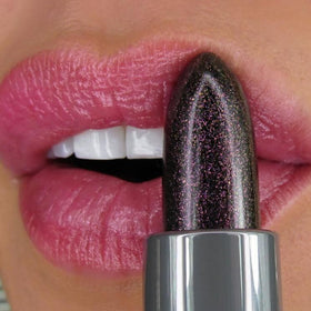 Winky Lux Aurora Glimmer Balm on lips showcasing mauve tint
