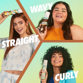 Woman applying Batiste Dark Dry Shampoo in hair