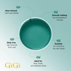 Woman applying GIGI Hard Wax Beads on her leg