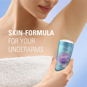 Woman applying Secret Fresh Antiperspirant Deodorant in daily routine