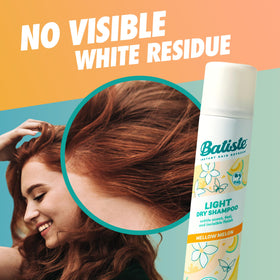 Woman using Batiste Light Dry Shampoo Mellow Melon in her hair