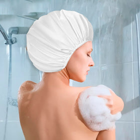 Woman using CHFONG shower cap while applying makeup