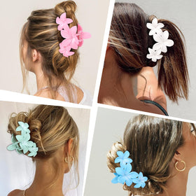 Woman wearing ANBALA flower claw clips at the beach