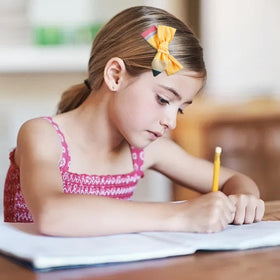 WOVOWOVO Pencil Hair Clips displayed with school supplies