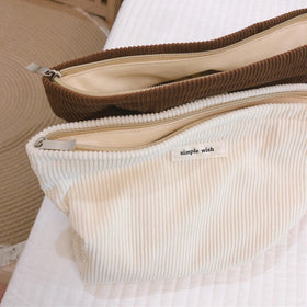 Wudygirl Makeup Bag in a travel suitcase
