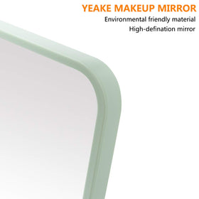 YEAKE 8-Inch Portable Folding Makeup Mirror hanging on bathroom wall