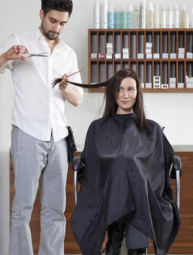 YELEGAI Hair Cutting Cape on a salon chair