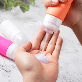 Zafit travel bottles set displayed with toiletries